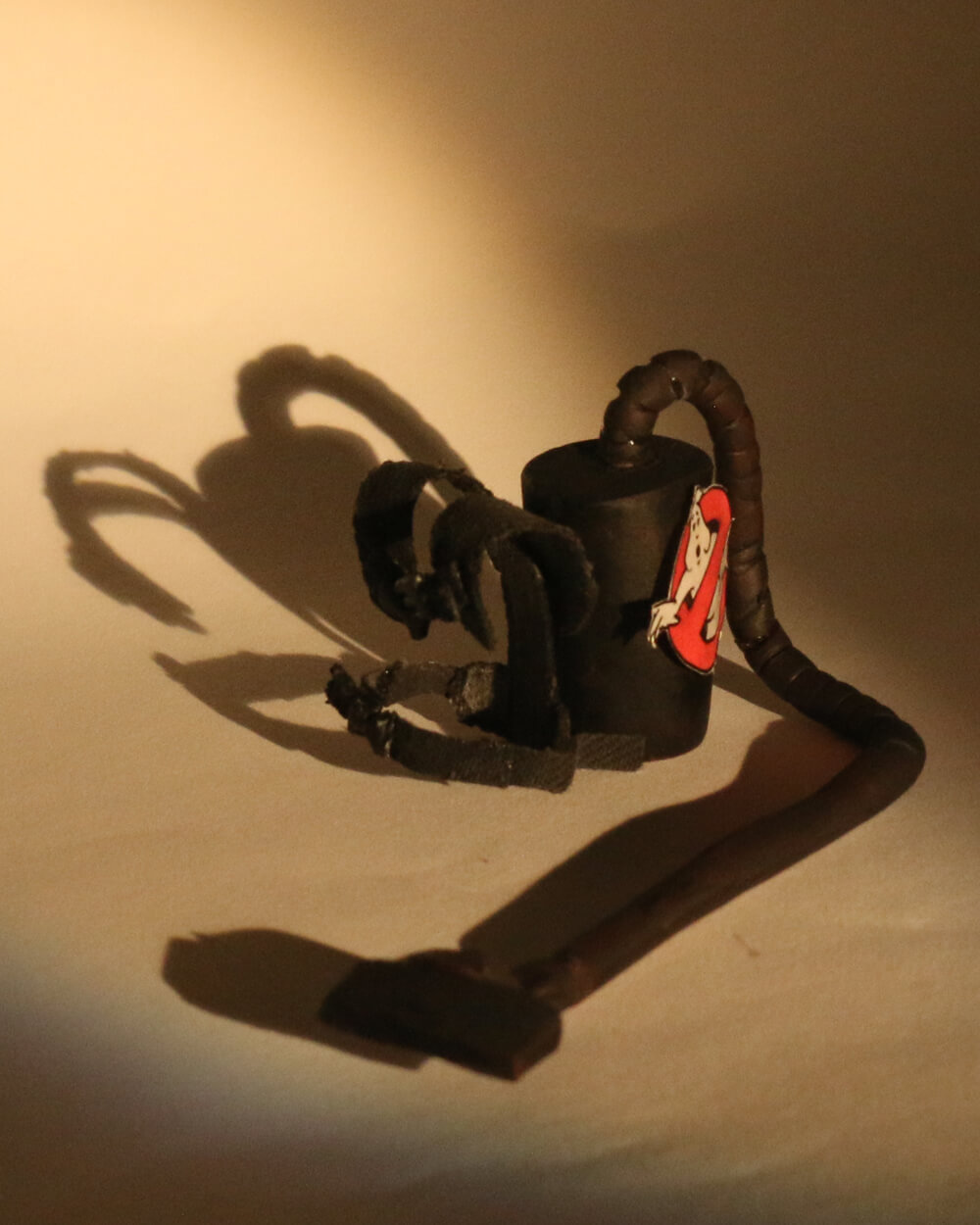 A miniature sculpture of a vacuum cleaner